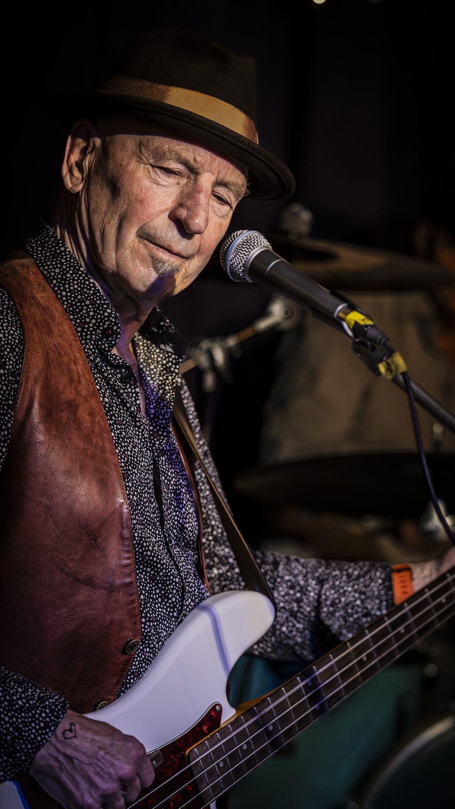 Bruce Grey close-up in leather vest and hat