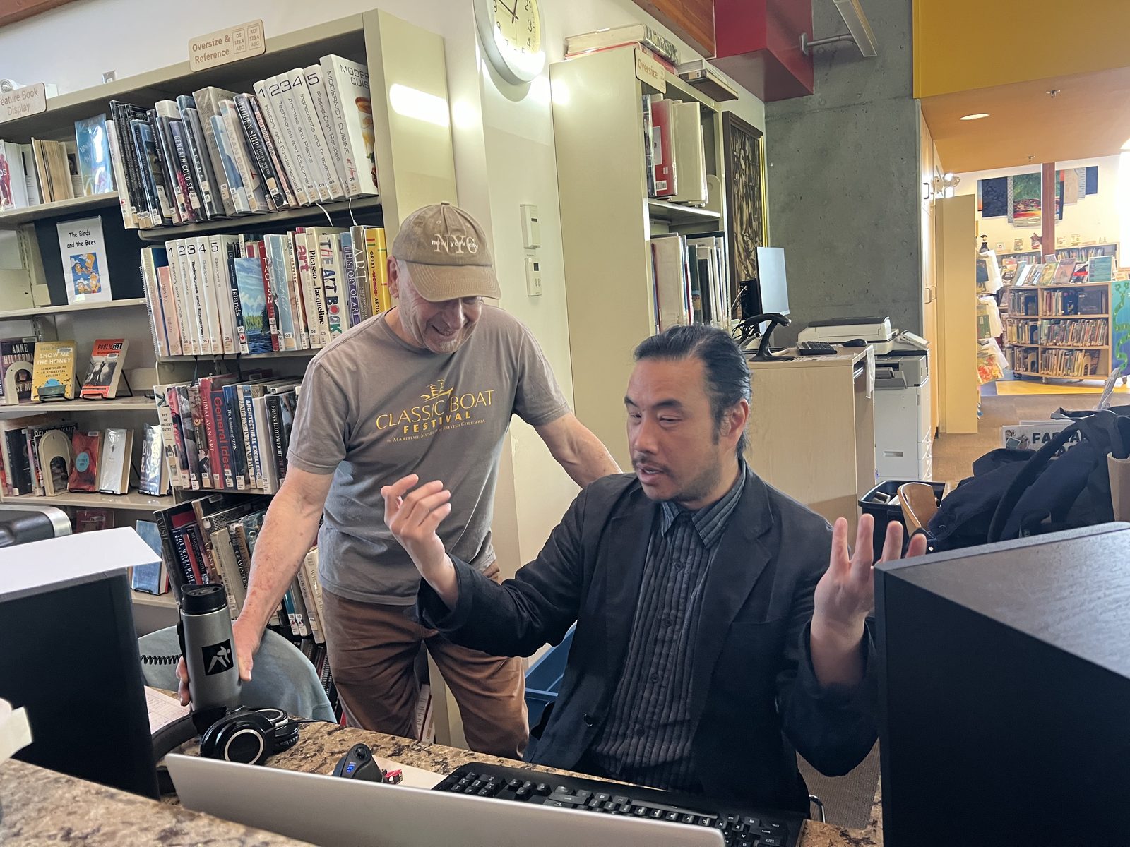 Felix Fung at the console with a band member